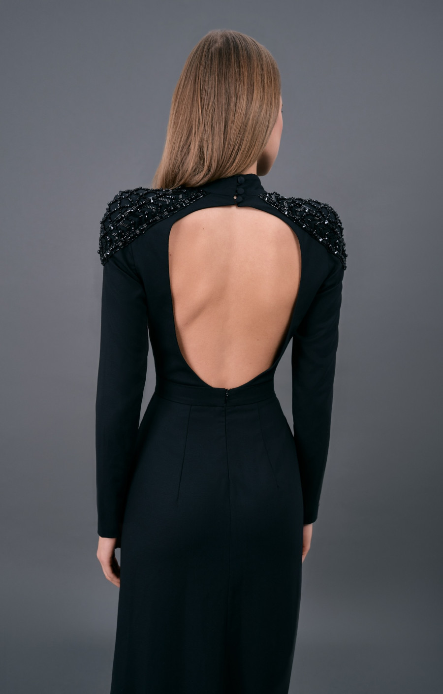 Black dress with an open back and embroidered shoulders